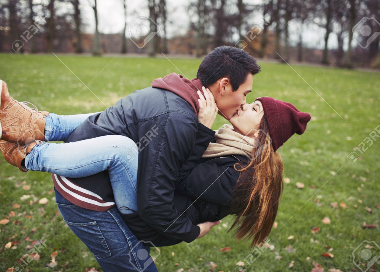 https://www.authorlove.com/wp-content/uploads/2016/11/25973406-Attractive-young-man-carrying-his-pretty-girlfriend-and-kissing-Mixed-race-couple-in-love-outdoors-i-Stock-Photo.jpg